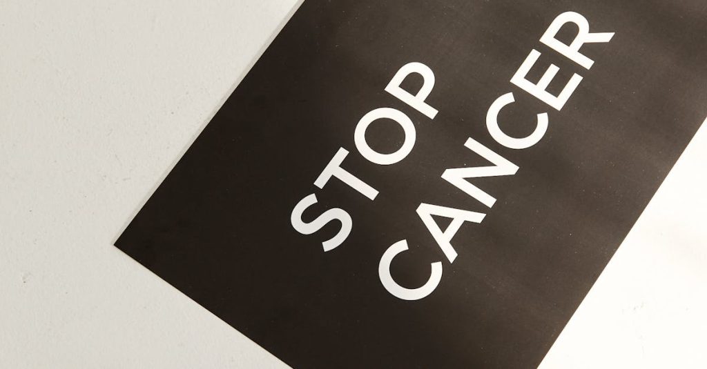 Inspirational image with 'Stop Cancer' text and razor, promoting awareness.